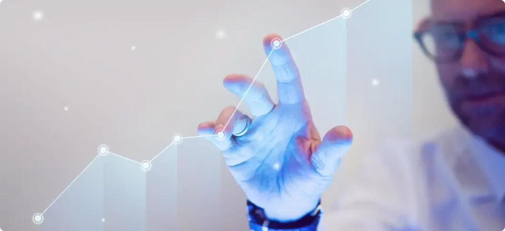 Imagem de uma pessoa interagindo com um gráfico digital, demonstrando crescimento e análise de dados. Ideal para gestão de clientes em uma carteira, garantindo melhores resultados